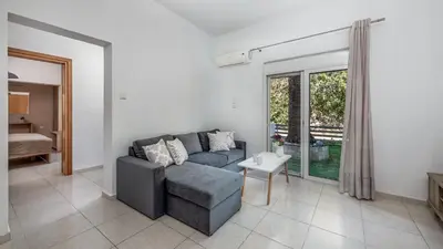 a living room with a couch and a table at Aleanna Cozy Luxury Apartments in Rhodes Town