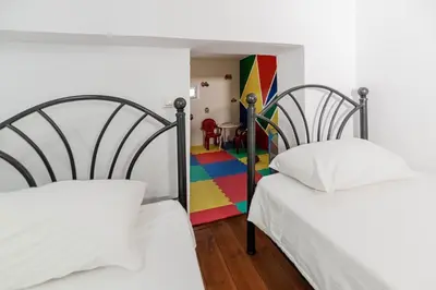 two beds in a room with a colorful room at Haraki Elegant View in Haraki