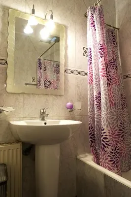 a bathroom with a sink and a shower curtain at Maisonnete Lilian in Rhodes Town