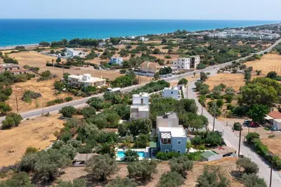 an aerial view of a town with the ocean at Villa Olvia in Gennadi