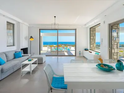 a living room with a couch and a table at Villa in Rhodes with Infinity Pool in Kalithies