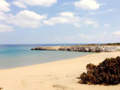 a view of a beach with the ocean and rocks at Villa in Rhodes with Infinity Pool in Kalithies