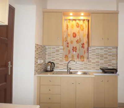 a kitchen with a sink and a window at GRANDMA'S HOUSE in Symi
