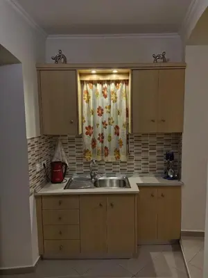 a kitchen with a sink and a window at GRANDMA'S HOUSE in Symi