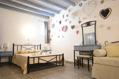 a living room with a couch and a table at Masì House in Rhodes Town