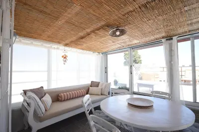 a living room with a couch and a table at Masì House in Rhodes Town