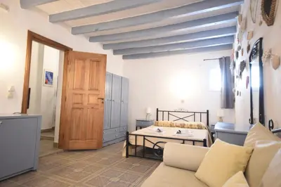 a living room with a couch and a table at Masì House in Rhodes Town
