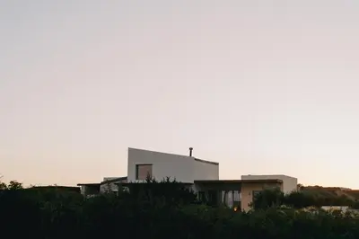 a white building on top of a hill at Alykes Beachside Stylish Villas with Private Pool South Rhodes in Lachania