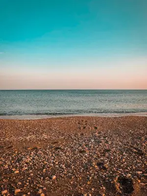 a sandy beach with the ocean in the background at Alykes Beachside Stylish Villas with Private Pool South Rhodes in Lachania