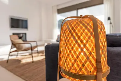 an orange suitcase sitting on a couch in a living room at Villa Lara AmberBlue Pefkos in Pefki Rhodes