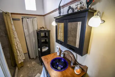 a bathroom with a sink and a mirror at anoi tholos in Symi