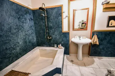 a bathroom with a sink and a shower at anoi tholos in Symi