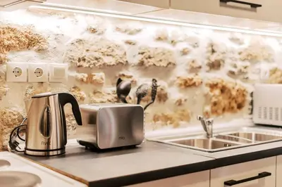 a kitchen counter with a toaster and a sink at Villa Gemma in Haraki