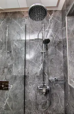 a shower with a shower head in a bathroom at Luxury apartment in the center in Rhodes Town