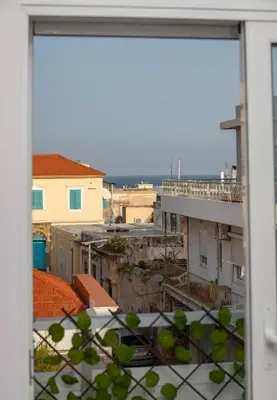 a view of a city from a window at Luxury apartment in the center in Rhodes Town