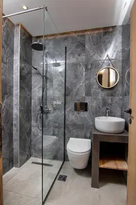 a bathroom with a shower and a toilet and a sink at Luxury apartment in the center in Rhodes Town
