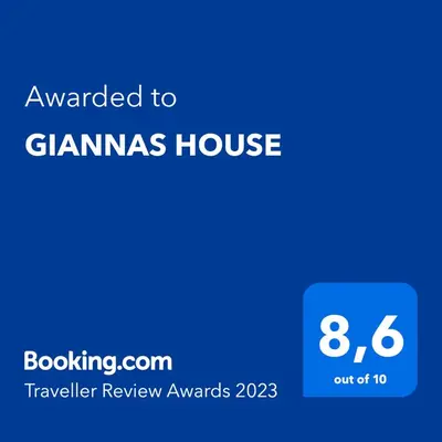 a screenshot of a phone with the text awarded to gannas house at GIANNAS HOUSE in Symi