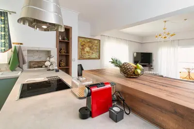 a kitchen with a counter with a pineapple on it at Casa di Flora Luxurious Apartment in Rhodes in Rhodes Town