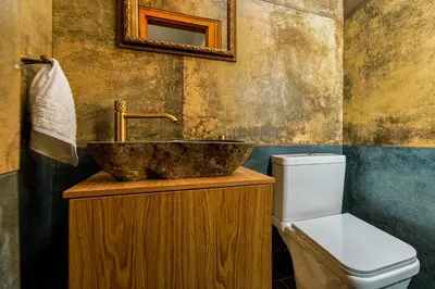 a bathroom with a sink and a toilet at Casa di Flora Luxurious Apartment in Rhodes in Rhodes Town