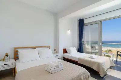 a bedroom with two beds with a view of the ocean at Villa Rhodes Sea View by Villa Plus in Ixia