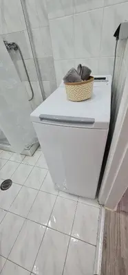 a bathroom with a toilet with a basket on it at Sea & Sun cozy studio in Kremasti