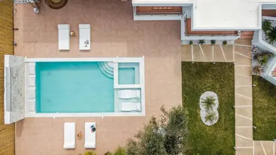 an overhead view of a swimming pool in a house at Le Ialyse Luxury Villa in Ialyssos