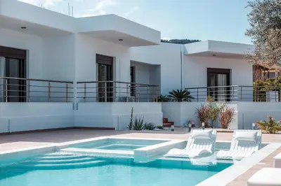 a villa with a swimming pool and a house at Le Ialyse Luxury Villa in Ialyssos
