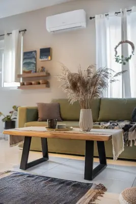 a living room with a couch and a coffee table at Inconceptual apartment in Paradeísion