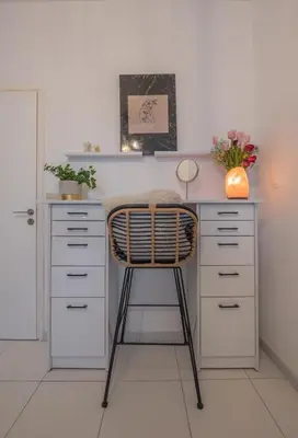 a desk with a chair in a room at Inconceptual apartment in Paradeísion