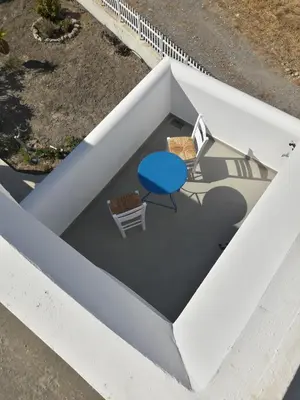 an overhead view of a table and chairs at Ktima Tzaneti - Coastal Farmhouse in Lachania