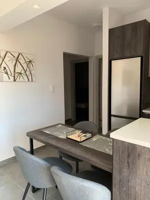 a dining room with a table and some chairs at Rhodes Comfort Luxury Apartment in Rhodes Town
