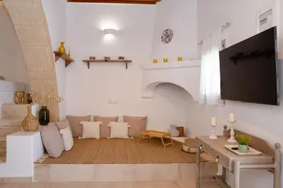 a living room with a tv and a couch at AENAON in Archangelos