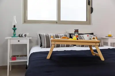 a tray of food sitting on top of a bed at Thalassa Luxury Villa in Ialyssos