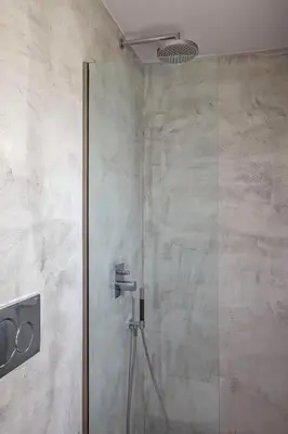 a shower with a glass door in a bathroom at Thalassa Luxury Villa in Ialyssos