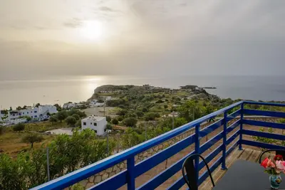 a view of the ocean from the balcony of a house at Villa Leonardo in Archangelos