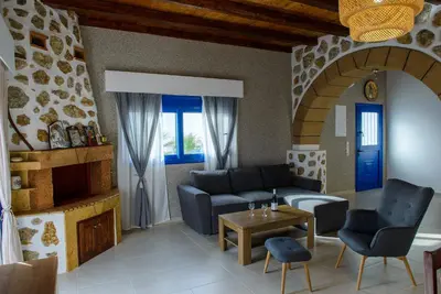 a living room with a couch and a table at Villa Leonardo in Archangelos