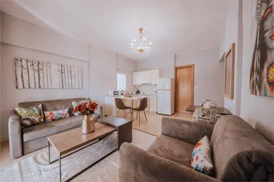 a living room with a couch and a table at Iliotti Apartments in Rhodes Town