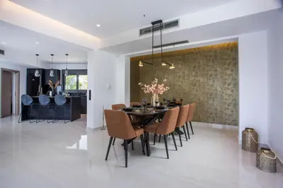 a dining room with a table and chairs at Villa Indira in Kalithies