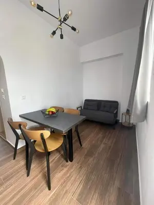 a living room with a table and chairs and a couch at Gennadi Beach Apartments in Gennadi