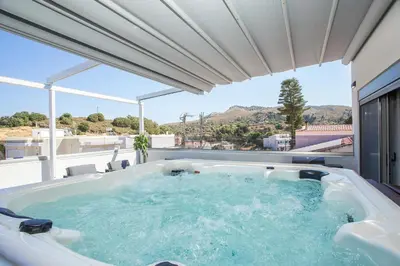 a hot tub on the roof of a house at GM Apartments-Rhodes Luxury Living in Kalithies