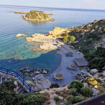 an aerial view of a rocky island in the ocean at SOLYMAR PRIVE in Archangelos