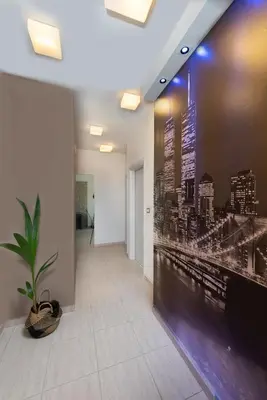an office hallway with a wall mural of a city at Alina in Triánta