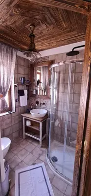 a bathroom with a shower and a sink and a toilet at Ey Sofias Suites in Rhodes Town