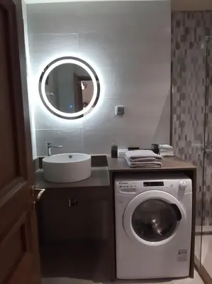 a bathroom with a washing machine and a sink at DIMITRA HOUSE in Rhodes Town