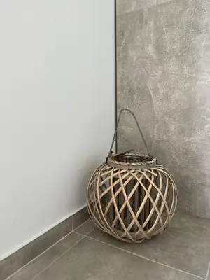 a basket sitting on the floor next to a wall at Vixen Apartment in Theologos
