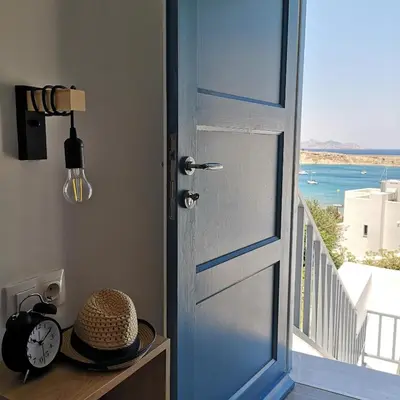 an open door with a view of the ocean at Villa Euphrosyne in Líndos