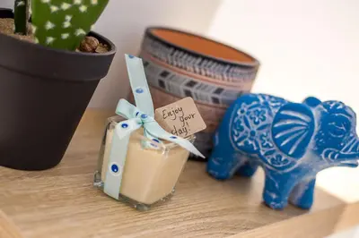 a figurine of a dog and a drink on a table at Villa Euphrosyne in Líndos