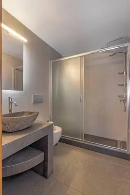 a bathroom with a sink and a toilet and a shower at Margaritis Luxury Medieval House in Rhodes Town