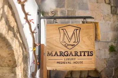 a sign for a margatories luxury medieval house at Margaritis Luxury Medieval House in Rhodes Town