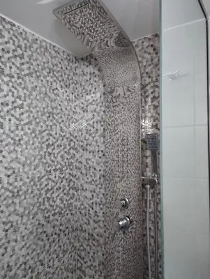 a shower with a glass door in a bathroom at Olivelia in Ixia